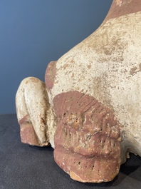 A pair of Chinese polychrome-painted terracotta camels with saddles, Tang