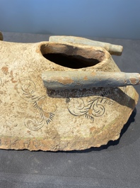 A pair of Chinese polychrome-painted terracotta camels with saddles, Tang