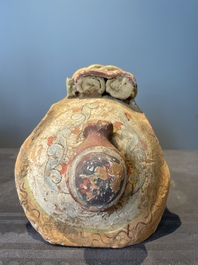 A pair of Chinese polychrome-painted terracotta camels with saddles, Tang