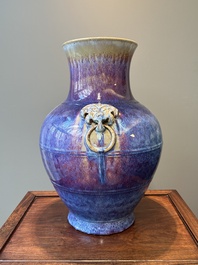 A large Chinese flamb&eacute; glaze 'hu' vase with Taotie handles, Qing