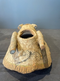 A pair of Chinese polychrome-painted terracotta camels with saddles, Tang
