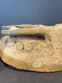 A pair of Chinese polychrome-painted terracotta camels with saddles, Tang