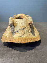A pair of Chinese polychrome-painted terracotta camels with saddles, Tang