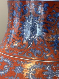 A Chinese blue and white, and iron-red 'bajixiang' 'hu' vase on wooden stand, Qianlong mark, 19th C.