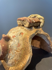 A pair of Chinese polychrome-painted terracotta camels with saddles, Tang