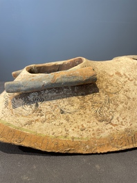A pair of Chinese polychrome-painted terracotta camels with saddles, Tang