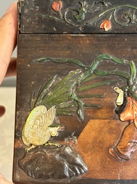 A square Chinese embellished and lacquered wooden box depicting a musician and two boys, Qing