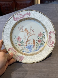 A pair of Chinese famille rose 'magpie and peony' plates with bianco-sopra-bianco rims, Yongzheng