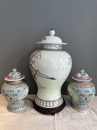 A Chinese famille rose covered vase and a pair of small covered vases, Qianlong mark, 20th C.