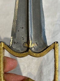 A collection of three daggers decorated with jade, silver and gold and an Indian mogul sword, India, 17/19th C.