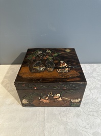 A square Chinese embellished and lacquered wooden box depicting a musician and two boys, Qing