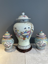 A Chinese famille rose covered vase and a pair of small covered vases, Qianlong mark, 20th C.