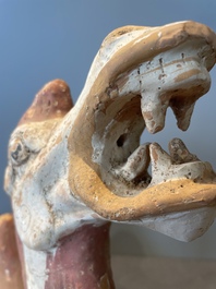 A pair of Chinese polychrome-painted terracotta camels with saddles, Tang