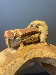 A pair of Chinese polychrome-painted terracotta camels with saddles, Tang
