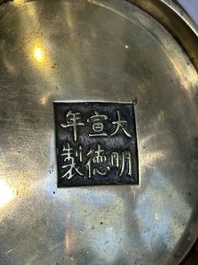 A Chinese bronze elephant-head-handled censer, Xuande mark, Kangxi/Qianlong