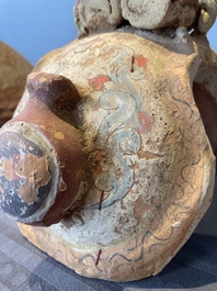 A pair of Chinese polychrome-painted terracotta camels with saddles, Tang