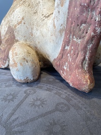 A pair of Chinese polychrome-painted terracotta camels with saddles, Tang