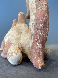 A pair of Chinese polychrome-painted terracotta camels with saddles, Tang