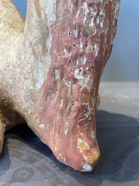 A pair of Chinese polychrome-painted terracotta camels with saddles, Tang