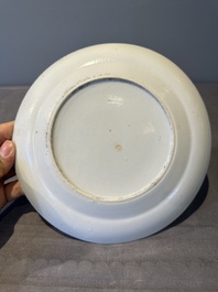 A large Chinese Canton famille rose dish and eight plates, 19th C.