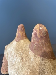 A pair of Chinese polychrome-painted terracotta camels with saddles, Tang