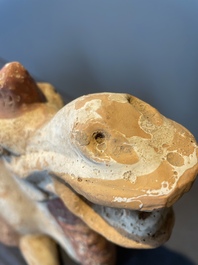 A pair of Chinese polychrome-painted terracotta camels with saddles, Tang