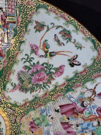 A large Chinese Canton famille rose dish and eight plates, 19th C.