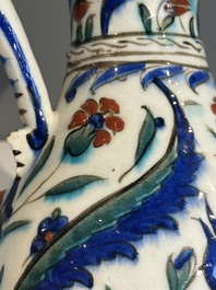 A polychrome and gilt Iznik ewer with tulips, carnation flowers and saz leaves, Turkey, ca. 1600