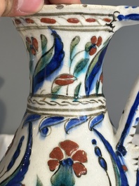 A polychrome and gilt Iznik ewer with tulips, carnation flowers and saz leaves, Turkey, ca. 1600