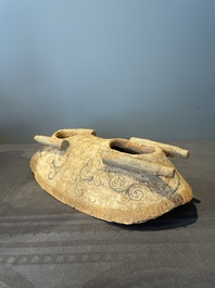 A pair of Chinese polychrome-painted terracotta camels with saddles, Tang