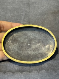 An oval Chinese imperial gold and silver filigree lidded 'dragon' box on reticulated stand and with presentation box, Qianlong mark and of the period
