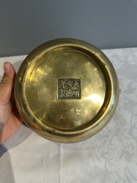 A Chinese bronze elephant-head-handled censer, Xuande mark, Kangxi/Qianlong