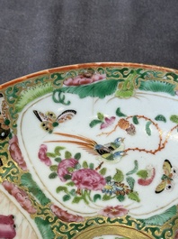 A large Chinese Canton famille rose dish and eight plates, 19th C.
