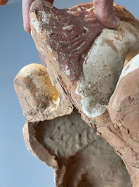 A pair of Chinese polychrome-painted terracotta camels with saddles, Tang
