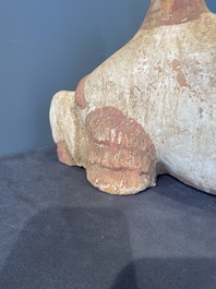 A pair of Chinese polychrome-painted terracotta camels with saddles, Tang