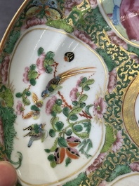A large Chinese Canton famille rose dish and eight plates, 19th C.