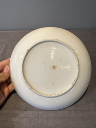 A large Chinese Canton famille rose dish and eight plates, 19th C.