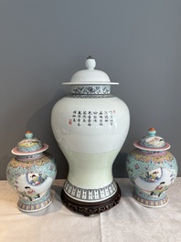 A Chinese famille rose covered vase and a pair of small covered vases, Qianlong mark, 20th C.