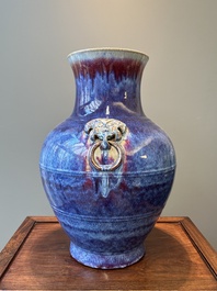A large Chinese flamb&eacute; glaze 'hu' vase with Taotie handles, Qing