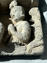 A Gandhara grey schist fragment of a seated Buddha with his disciple and a fragment with five figures, 1st/3rd C.