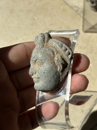 A collection of 9 Gandhara grey schist and stucco fragments of Buddha and divinities, 1/2nd C.