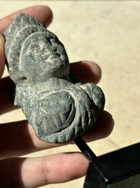 A collection of 9 Gandhara grey schist and stucco fragments of Buddha and divinities, 1/2nd C.