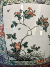 A Chinese famille verte covered vase and a bottle vase, 19th C.