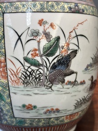 A Chinese famille verte covered vase and a bottle vase, 19th C.