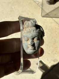 A collection of 9 Gandhara grey schist and stucco fragments of Buddha and divinities, 1/2nd C.