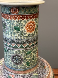 A Chinese famille verte covered vase and a bottle vase, 19th C.