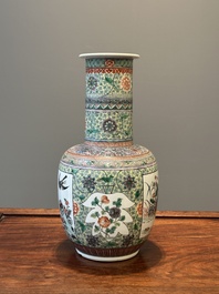 A Chinese famille verte covered vase and a bottle vase, 19th C.