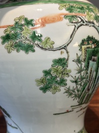A Chinese famille verte covered vase and a bottle vase, 19th C.