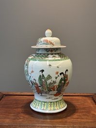 A Chinese famille verte covered vase and a bottle vase, 19th C.