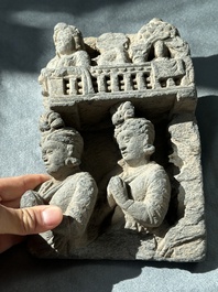 A Gandhara grey schist fragment of a seated Buddha with his disciple and a fragment with five figures, 1st/3rd C.